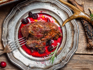 Venison  steak with red currant